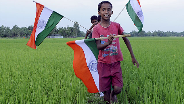 Children wave the Indian flag to celebrate the exchange of enclaves between India and Bangladesh. The exchange of 162 enclaves is taking place on July 31, 2015, marking the start of implementation of their landmark land boundary agreement.