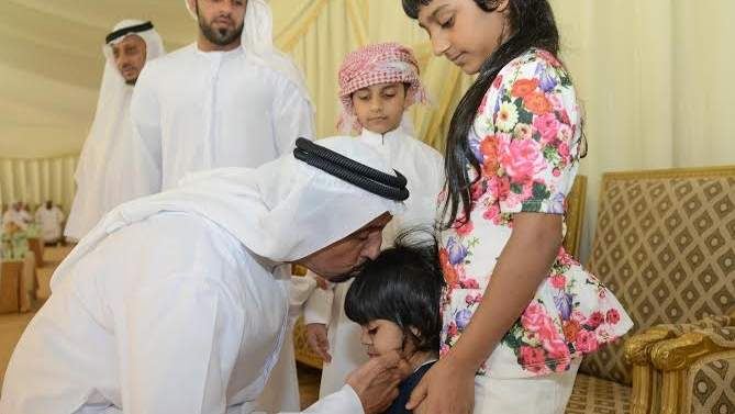 Dr Shaibani comforting the little kid of martyr Ali Hassan Al Shehi