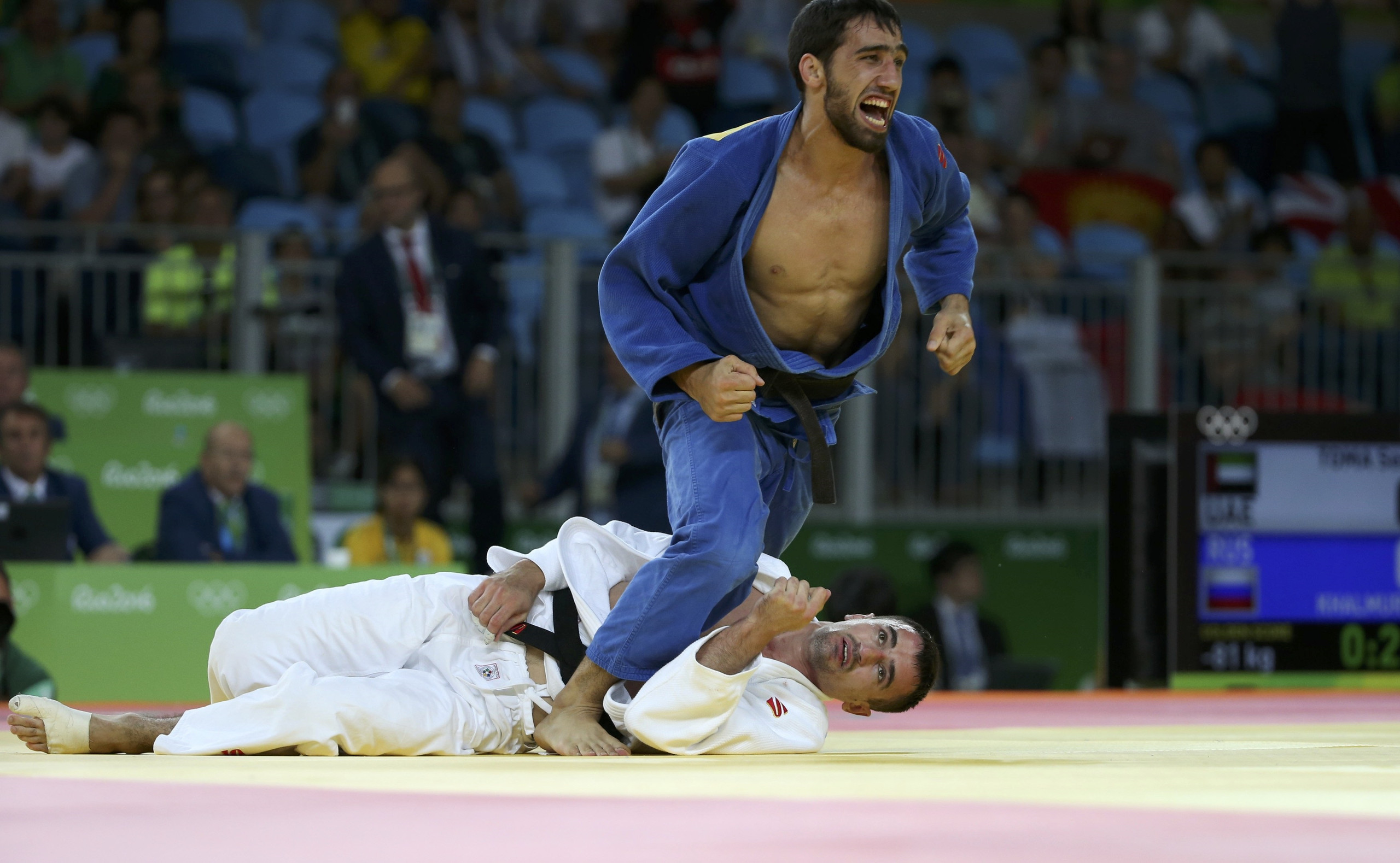 2016 Rio Olympics - Judo - Semifinal - Men -81 kg Semifinal Contests - Carioca Arena 2 - Rio de Janeiro, Brazil - 09/08/2016. Sergiu Toma (UAE) of United Arab Emirates and Khasan Khalmurzaev (RUS) of Russia react. REUTERS/Toru Hanai FOR EDITORIAL USE ONLY. NOT FOR SALE FOR MARKETING OR ADVERTISING CAMPAIGNS.