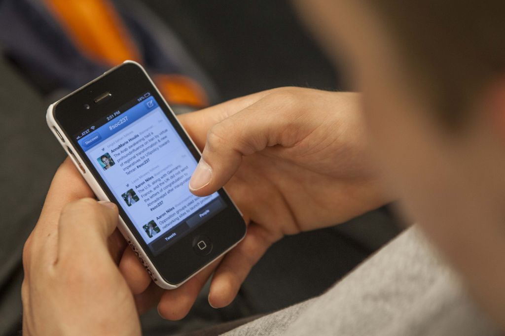 Youngster Using Facebook in Mobile